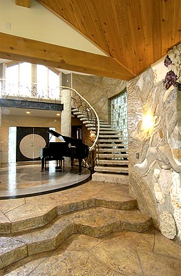 Bomanite interior concrete floors and walls in a beautiful House with a grand Piano