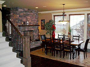 Decorative Concrete Home with vertically carved concrete fireplace that is colored to replicate real stone.