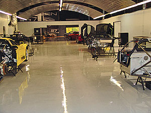 Seamless Floor Coatings in an large industrial warehouse where heavy machines are moved across the floor.