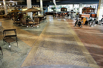An award-winning stamped concrete floor in The Great Escape, a store in Joliet, Ill. where three different stamp designs were used to make way finding easier.
