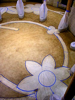Specialized Construction Services - Architects and designers working on the construction of the new Potawatomi Executive Building developed an elaborate stained-concrete floral pattern for the rotunda floor.
