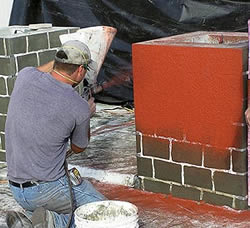"The stucco-style plastering technique is the most common way to apply stencils to a vertical surface, Monroe says. The other common method is to use stencils and colorants when creating decorative flatwork for tilt-up construction. Photos courtesy of Decorative Concrete Impressions Applying and troweling a stenciled overlay.