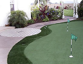 The golf ball patio, which was designed by Cohen, took about two to three weeks to finish. First, the team applied white color hardener to natural gray concrete and let it cure. They used an oyster white stain from Kemiko Concrete Staining with a touch of acrylic stain for the color of the ball.