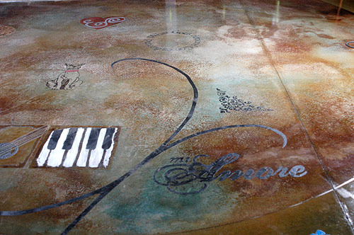 Concrete artisan Shellie Rigsby use decorative concrete for artistic expression. So when installing a decorative concrete floor at a youth center she envited the young people there to put their own stamp on the place.