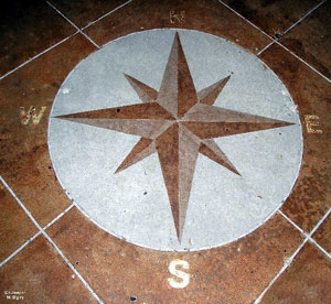 An artist used SoyCrete to create this compass design on an outdoor patio.