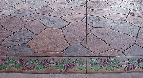 This grapevine design shows how Bob Harris uses water-based acrylic stain to accent acid-stained stamped vertical concrete.