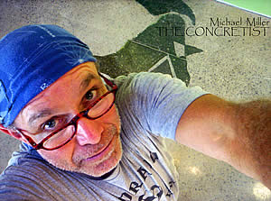 Mike Miller, The Concretitst image of Mike looking up into a camera showcasing his concrete stain design in the background.