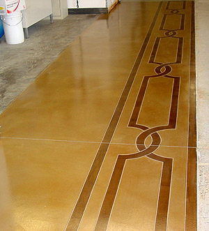 Overlays on Concrete Floors - Native American design flows down a hall way that has a microtopping overlay treatment.