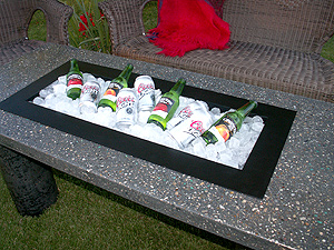 This concrete table can be used as a place to keep beverages cool as well.
