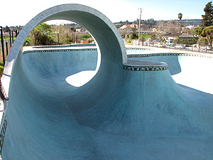A side view of the full pipe at a skate park in Santa Cruz