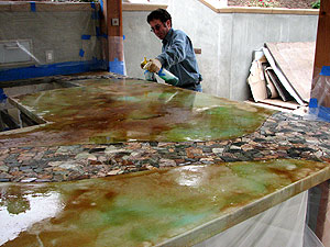 Tom Ralston, Tom Ralston Concrete - I use acid stains made by a variety of manufacturers. I use different brands for different color options, and I have also gotten raw product to make my own custom colors. Because they are made from iron oxides, acid stains stain concrete very much like iron oxides stain rocks  its very natural-looking.