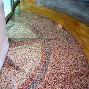 A half of a compass rose placed using terrazzo.