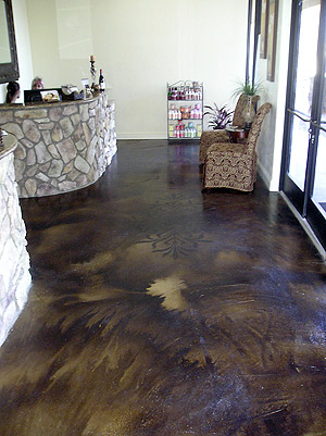 Acid stained concrete floor with designs imprinted into it add depth and dimension.