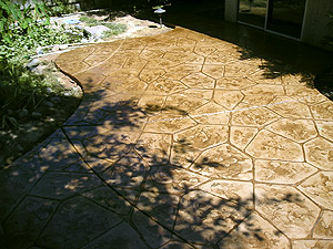 Outdoor concrete patio that has been stamped and stained.