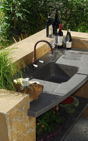 Concrete Countertops in an outdoor kitchen with a sink.