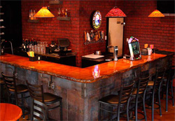 Concrete countertops were installed on the bar to take the decorative concrete makeover to another level.
