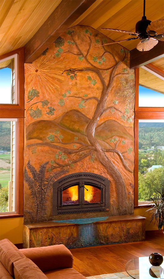 Floor to ceiling concrete fireplace with a tree carved and colored to add an artistic flair to this rustic home.
