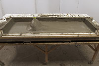Step 12: Slowly pour the self-consolidating back coat into your mold. Work the concrete around the edges and corners to release any air pockets.
