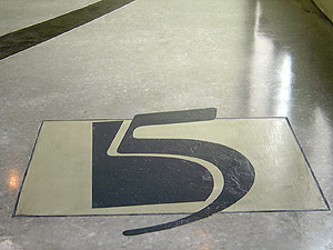 The number 5 engraved into the concrete.