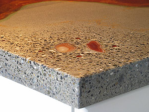 Absolute ConcreteWorks uses natural materials as decorative accents. Here, a countertop features Brazilian agate inlaid in a terrazo finish with acid-stained borders. Also, 31 pounds of portland cement were eliminated by replacing 22 percent of the mixture with fly ash.