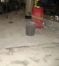 The concrete floor before its restoration was complete. 