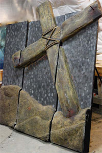 Decorative concrete cross in three pieces as wall art,