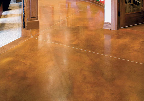 This surface, colored with L.M. Scofields Lithocrome Chemstain acid stain, has a mottled and irregular appearance that is intended to closely resemble the shadings of nature. The stain allows surface imperfections to become part of the distinctive beauty of the floor.