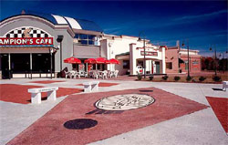 CSolutions made over this restaurant outdoor seating area in reds and grays to match the decor and vibe of this outfit.