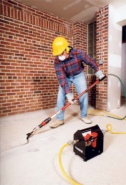 surface preparation is done by a man with a vacuum and a shovel.